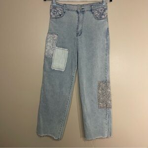 Vintage-inspired patchwork jeans by Polagram in a light wash denim. size M